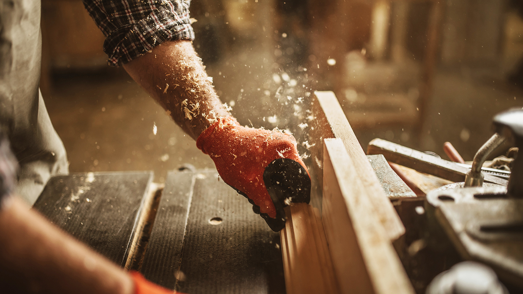 carpenter works with manual and electric equipment
